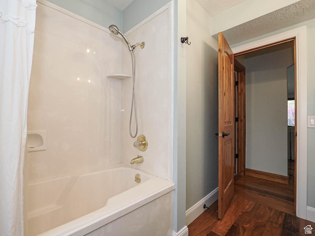 418 E Bridlewalk Ln, Murray, UT 84107 - bathroom featuring shower / bath combo with shower curtain, baseboards, and wood finished floors