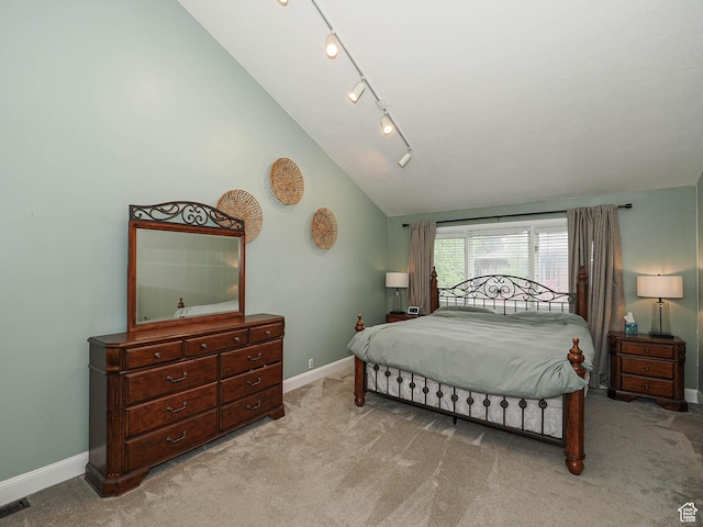 418 E Bridlewalk Ln, Murray, UT 84107 - bedroom featuring baseboards, rail lighting, vaulted ceiling, and light colored carpet