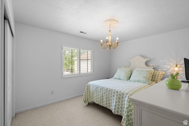 6272 S Lake Fork Cir, Taylorsville, UT 84129 - bedroom featuring visible vents, baseboards, a textured ceiling, carpet flooring, and a notable chandelier