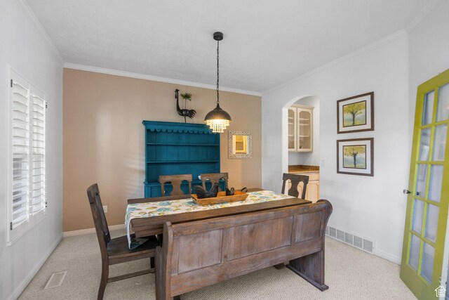 6272 S Lake Fork Cir, Taylorsville, UT 84129 - dining area with crown molding, light colored carpet, and visible vents