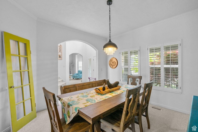 6272 S Lake Fork Cir, Taylorsville, UT 84129 - dining room with arched walkways, baseboards, light colored carpet, and ornamental molding