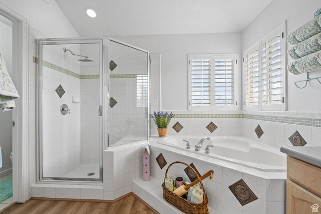 6272 S Lake Fork Cir, Taylorsville, UT 84129 - bathroom with a shower stall, wood finished floors, a garden tub, and vanity