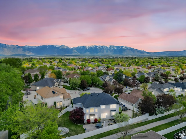 6272 S Lake Fork Cir, Taylorsville, UT 84129 - aerial view at dusk with a residential view and a mountain view