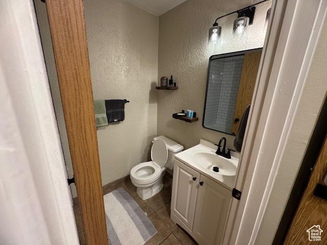 1940 Prospector Ave Unit 207, Park City, UT 84060 - bathroom featuring tile patterned flooring, vanity, baseboards, toilet, and a textured wall