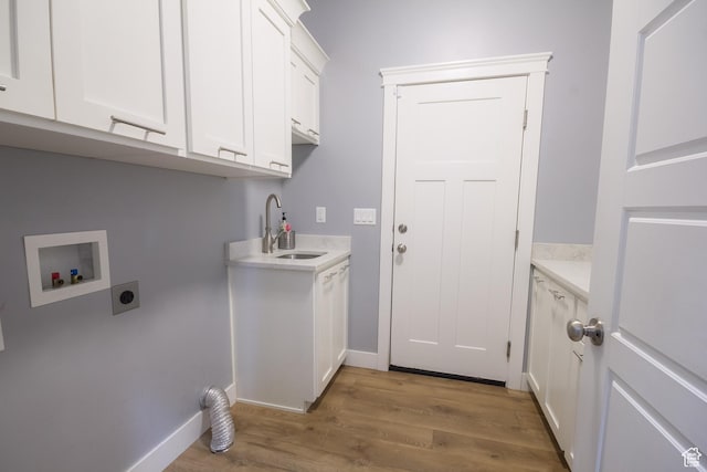 1428 N 4075 W, Vernal, UT 84078 - laundry room with cabinet space, a sink, hookup for a washing machine, light wood-style flooring, and hookup for an electric dryer