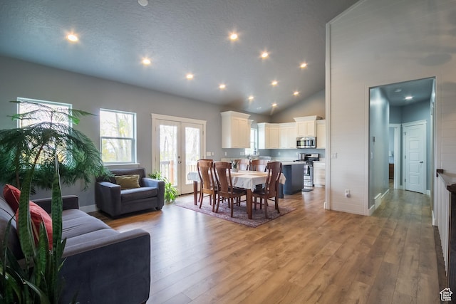 1428 N 4075 W, Vernal, UT 84078 - dining room with light wood-style floors, high vaulted ceiling, french doors, recessed lighting, and baseboards