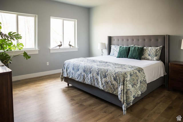 1428 N 4075 W, Vernal, UT 84078 - bedroom with baseboards, visible vents, and wood finished floors