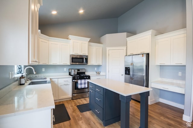 1428 N 4075 W, Vernal, UT 84078 - kitchen featuring stainless steel appliances, high vaulted ceiling, white cabinetry, and a sink