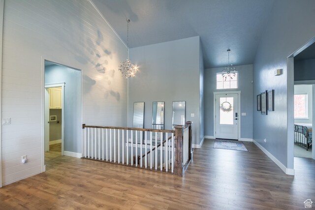 1428 N 4075 W, Vernal, UT 84078 - entryway featuring baseboards, a chandelier, wood finished floors, and a towering ceiling