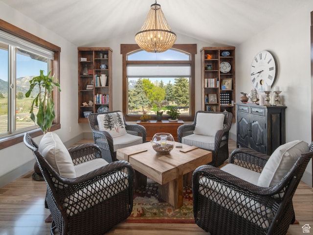 3540 N Elkview Dr, Eden, UT 84310 - living area featuring an inviting chandelier, wood finished floors, and vaulted ceiling