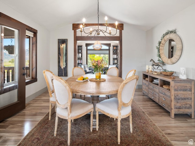 3540 N Elkview Dr, Eden, UT 84310 - dining area featuring baseboards, an inviting chandelier, lofted ceiling, and light wood-style floors