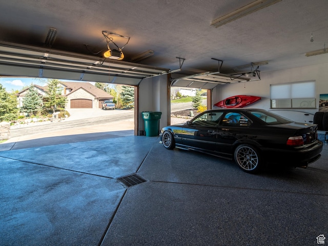 3540 N Elkview Dr, Eden, UT 84310 - garage featuring a garage door opener