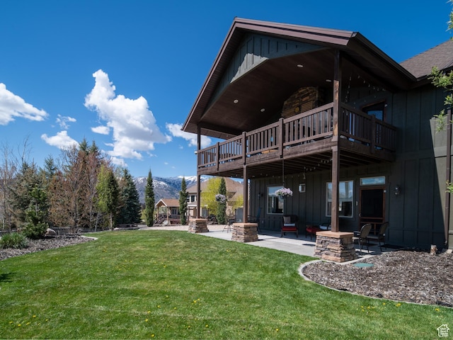 3540 N Elkview Dr, Eden, UT 84310 - back of property featuring a mountain view, board and batten siding, a yard, and a patio area