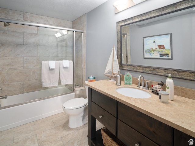 3540 N Elkview Dr, Eden, UT 84310 - bathroom with vanity, toilet, a textured ceiling, tile patterned floors, and enclosed tub / shower combo