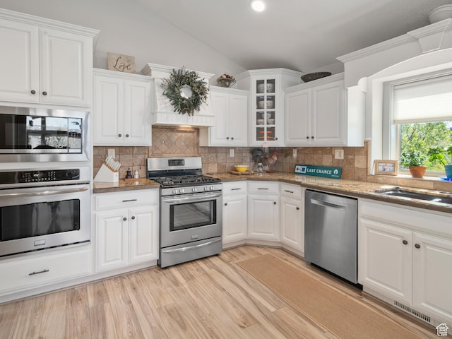 3540 N Elkview Dr, Eden, UT 84310 - kitchen with visible vents, stainless steel appliances, white cabinets, and lofted ceiling