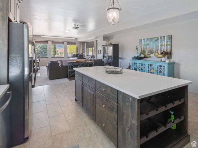 3540 N Elkview Dr, Eden, UT 84310 - kitchen featuring light countertops, dark brown cabinetry, appliances with stainless steel finishes, and open floor plan