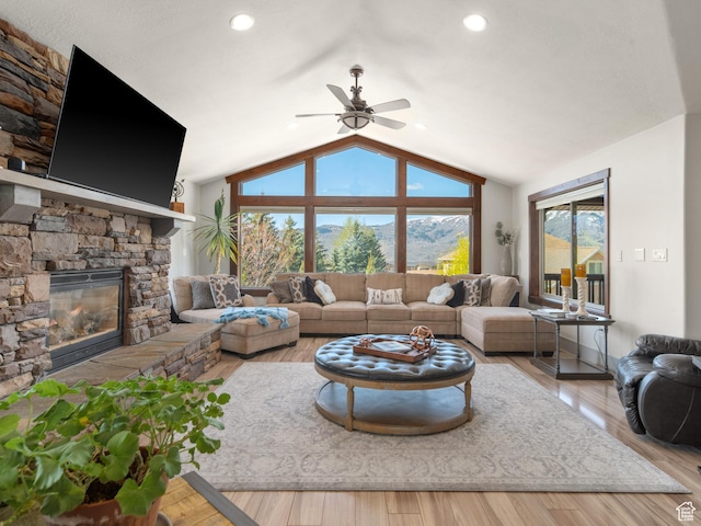3540 N Elkview Dr, Eden, UT 84310 - living area with a ceiling fan, wood finished floors, lofted ceiling, and a fireplace