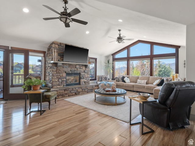 3540 N Elkview Dr, Eden, UT 84310 - living area with a ceiling fan, vaulted ceiling, a stone fireplace, and wood finished floors