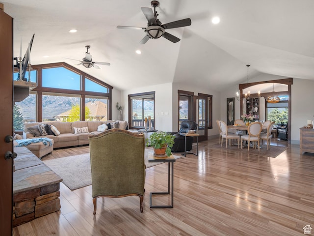 3540 N Elkview Dr, Eden, UT 84310 - living area featuring plenty of natural light, lofted ceiling, and ceiling fan with notable chandelier