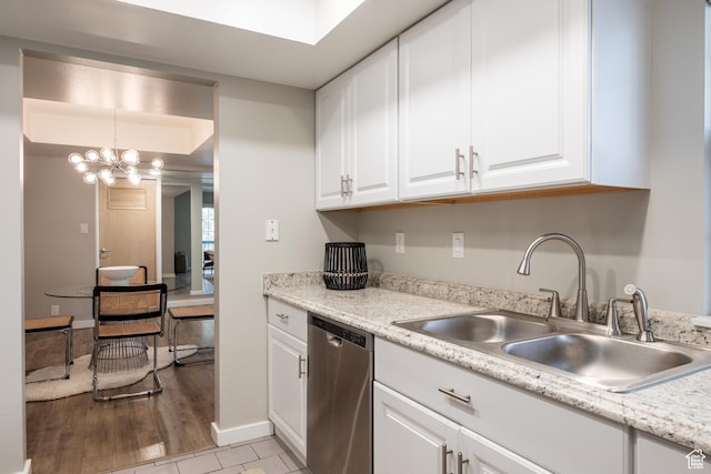 636 E 3990 S Unit D, Millcreek, UT 84107 - kitchen featuring light countertops, white cabinets, a sink, dishwasher, and a notable chandelier
