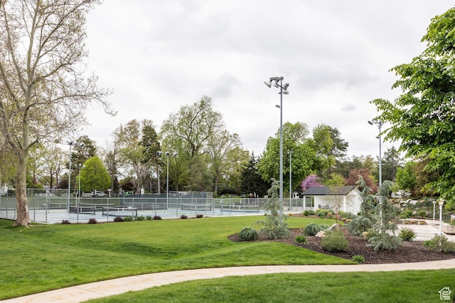 636 E 3990 S Unit D, Millcreek, UT 84107 - surrounding community with fence, a tennis court, and a yard