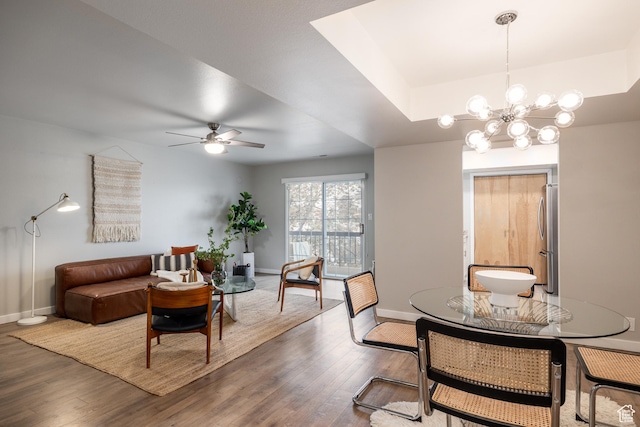 636 E 3990 S Unit D, Millcreek, UT 84107 - dining area with baseboards, wood finished floors, and ceiling fan with notable chandelier
