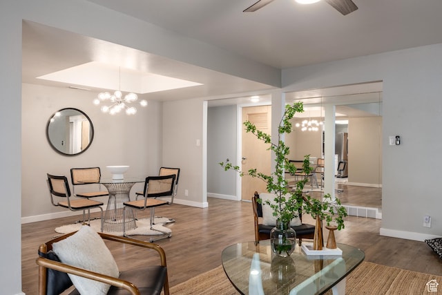 636 E 3990 S Unit D, Millcreek, UT 84107 - dining space with baseboards, wood finished floors, and ceiling fan with notable chandelier