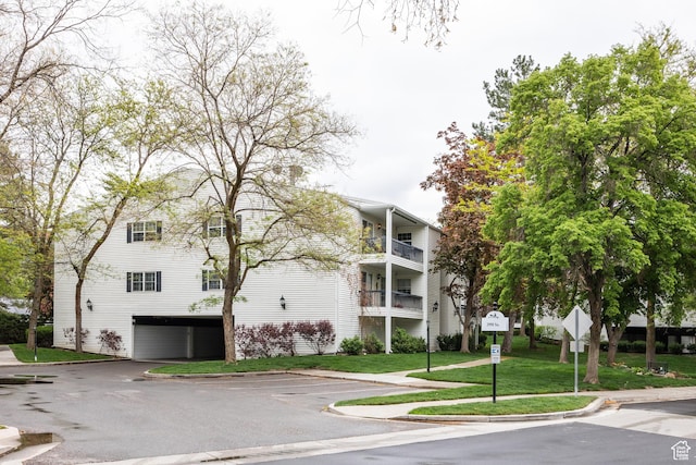 636 E 3990 S Unit D, Millcreek, UT 84107 - view of building exterior featuring uncovered parking