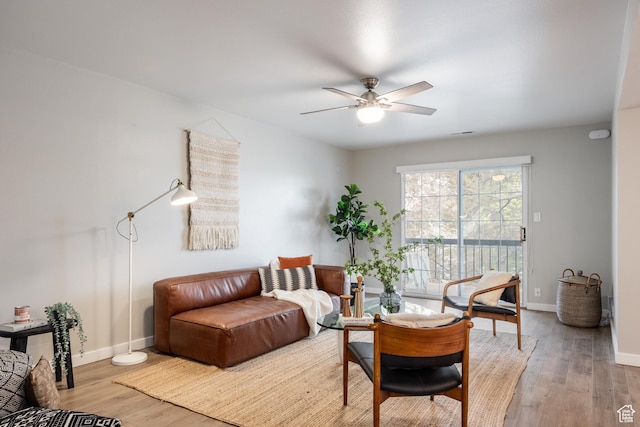 636 E 3990 S Unit D, Millcreek, UT 84107 - living room with baseboards, a ceiling fan, and light wood finished floors