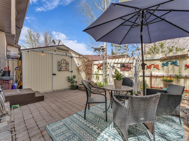 181 Geneva Dr, Midway, UT 84049 - view of patio featuring outdoor dining space and an outbuilding