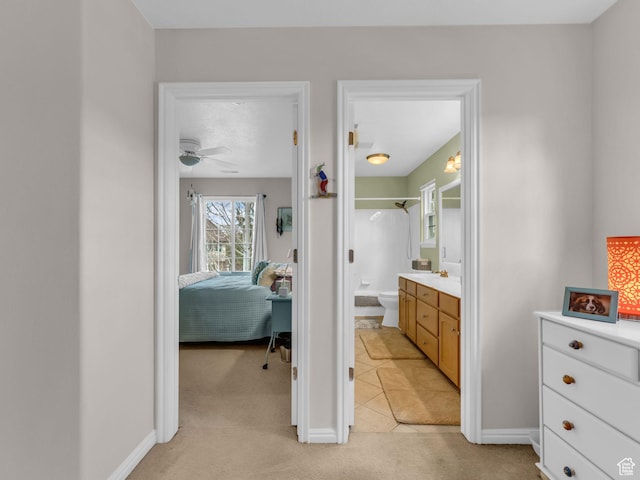 181 Geneva Dr, Midway, UT 84049 - bedroom with light tile patterned floors, baseboards, connected bathroom, and light colored carpet