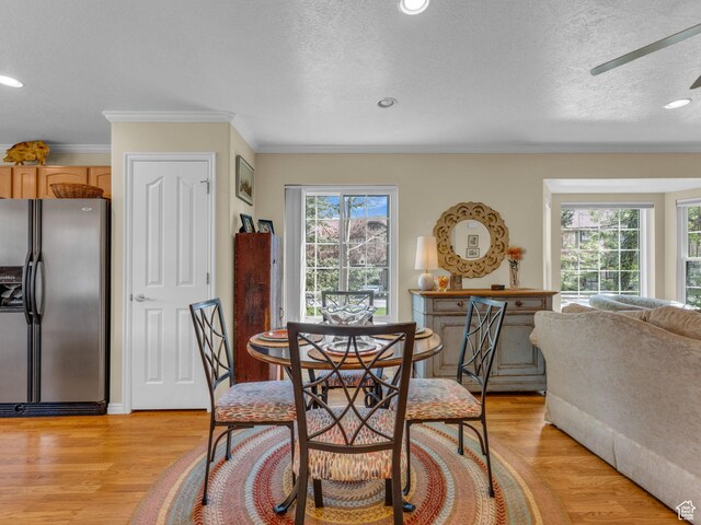 181 Geneva Dr, Midway, UT 84049 - dining room featuring a textured ceiling, ornamental molding, and light wood finished floors