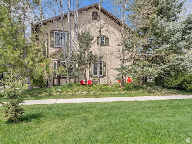 181 Geneva Dr, Midway, UT 84049 - exterior space featuring a lawn and stucco siding