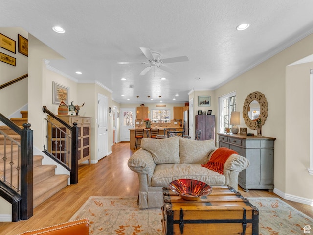 181 Geneva Dr, Midway, UT 84049 - living room featuring recessed lighting, light wood-style flooring, ceiling fan, and stairs