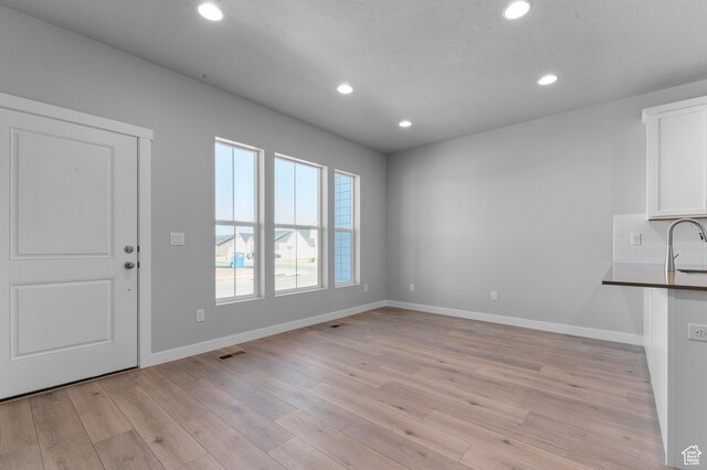 6589 W Bannon St, West Jordan, UT 84081 - interior space featuring recessed lighting, baseboards, visible vents, and light wood finished floors