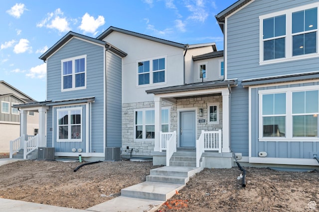 6589 W Bannon St, West Jordan, UT 84081 - view of front facade with cooling unit and stone siding