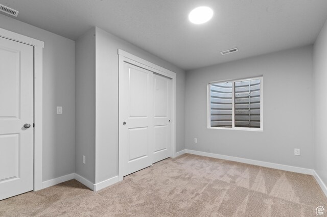 6589 W Bannon St, West Jordan, UT 84081 - unfurnished bedroom with visible vents, carpet, baseboards, and a closet