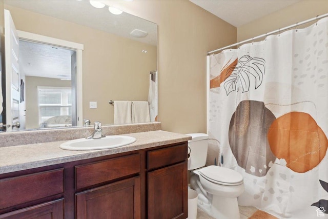 1026 N Shepard Pkwy Unit 3, Farmington, UT 84025 - ensuite bathroom with vanity, toilet, connected bathroom, and tile patterned floors
