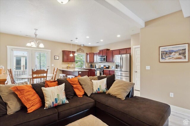 1026 N Shepard Pkwy Unit 3, Farmington, UT 84025 - living room with an inviting chandelier, baseboards, and recessed lighting