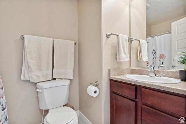 1026 N Shepard Pkwy Unit 3, Farmington, UT 84025 - bathroom featuring vanity, toilet, and baseboards