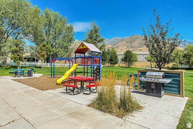 1026 N Shepard Pkwy Unit 3, Farmington, UT 84025 - community playground featuring a lawn, a mountain view, and fence