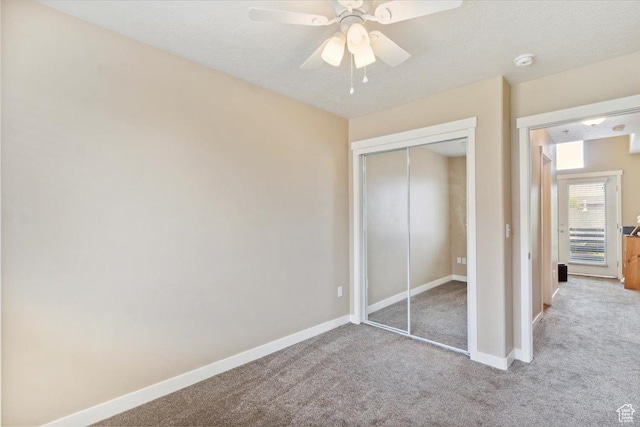 1026 N Shepard Pkwy Unit 3, Farmington, UT 84025 - unfurnished bedroom featuring ceiling fan, carpet, a closet, and baseboards