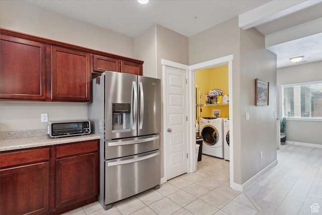 1026 N Shepard Pkwy Unit 3, Farmington, UT 84025 - kitchen featuring independent washer and dryer, a toaster, stainless steel fridge, light countertops, and dark brown cabinets