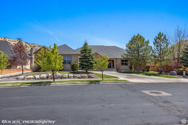 1328 N Parkside Dr, Cedar City, UT 84721 - view of front facade featuring stucco siding and concrete driveway