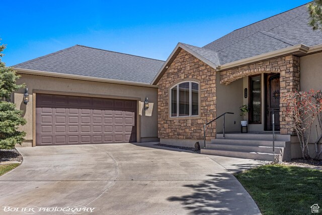 1328 N Parkside Dr, Cedar City, UT 84721 - ranch-style home with a shingled roof, stone siding, a garage, stucco siding, and driveway