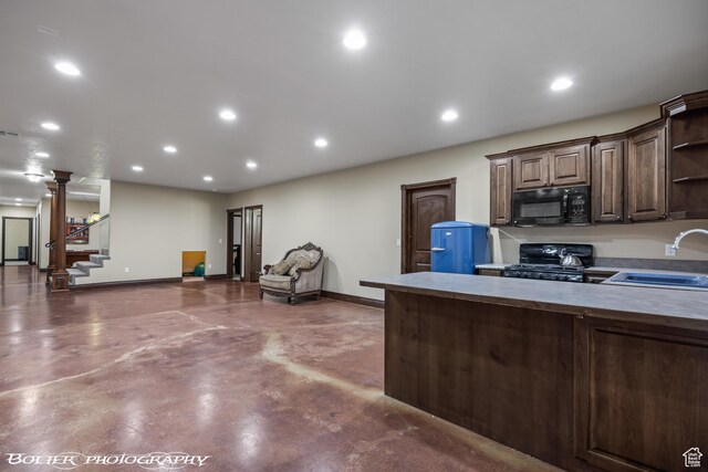 1328 N Parkside Dr, Cedar City, UT 84721 - kitchen featuring open shelves, black microwave, a sink, finished concrete flooring, and range