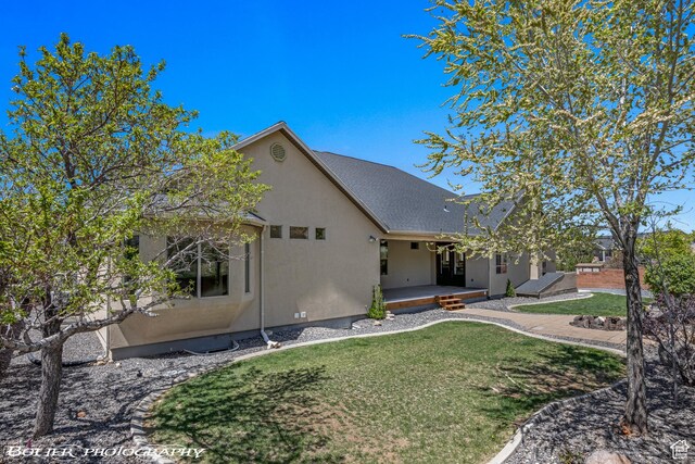 1328 N Parkside Dr, Cedar City, UT 84721 - view of front of home featuring roof with shingles, a front yard, and stucco siding