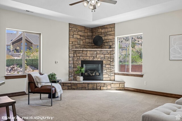 1328 N Parkside Dr, Cedar City, UT 84721 - living area featuring ceiling fan, a stone fireplace, visible vents, baseboards, and carpet