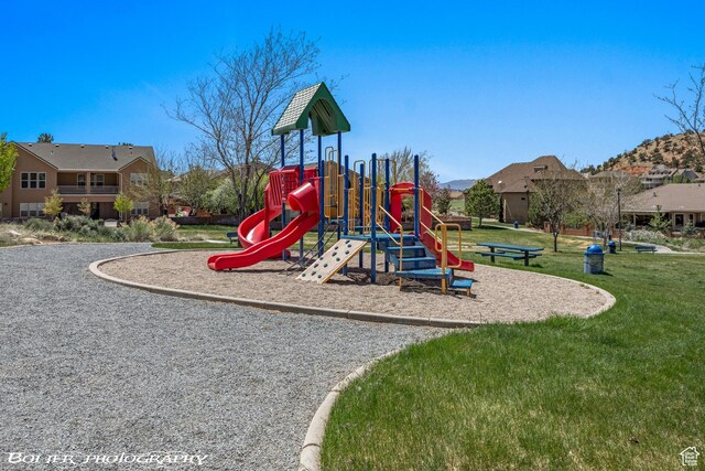 1328 N Parkside Dr, Cedar City, UT 84721 - community jungle gym featuring a lawn and a residential view