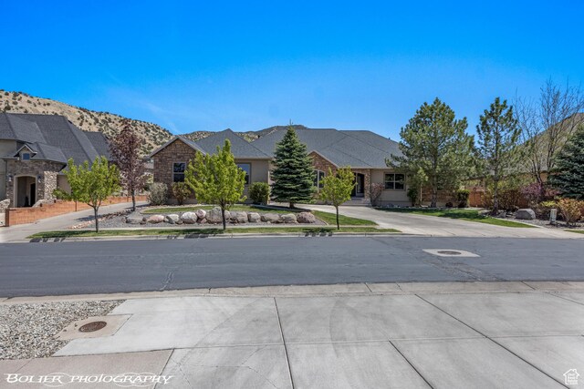 1328 N Parkside Dr, Cedar City, UT 84721 - view of street with a mountain view and sidewalks